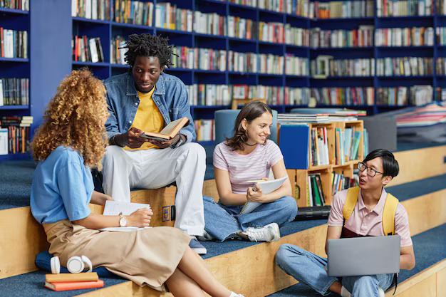 Students studying together with books
